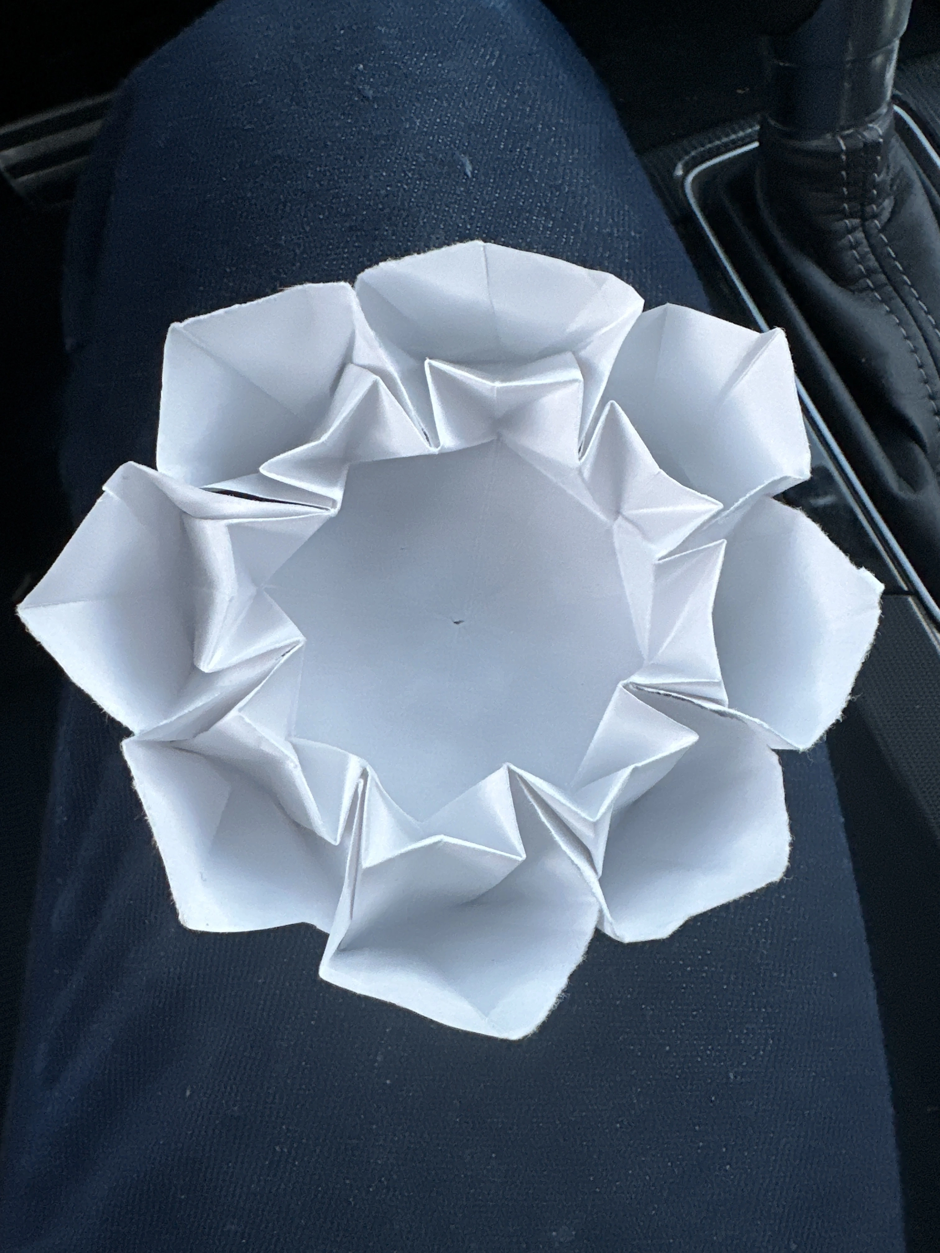 front of intricate geometric collapse origami creation